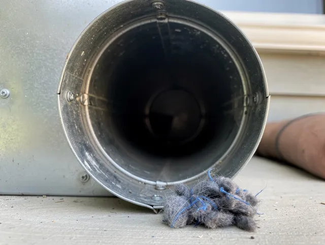 Bethel Dryer Vent Cleaning technician using specialized equipment to clear severe dryer vent blockage in Bethel